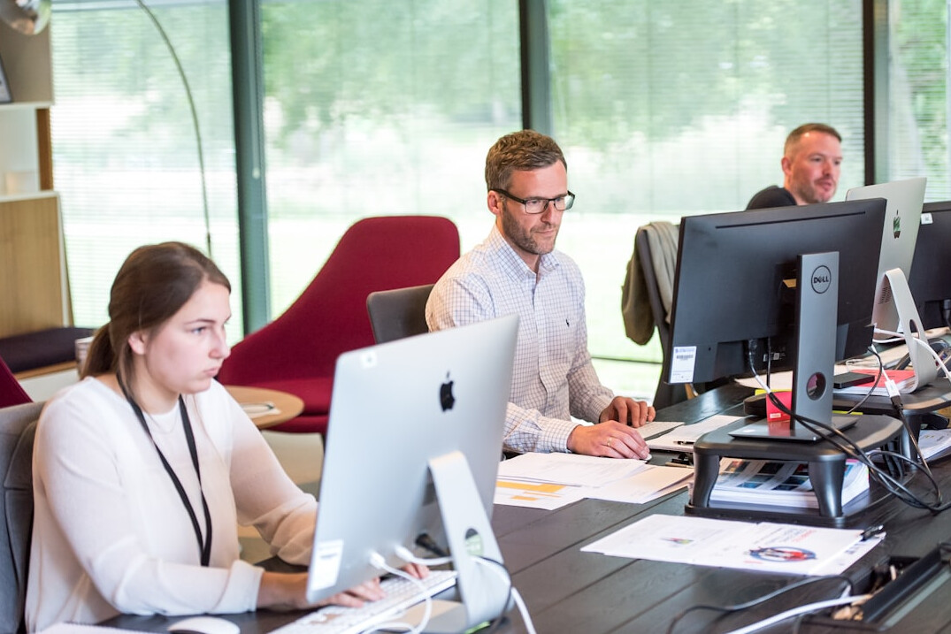 corporate team discussing custom software