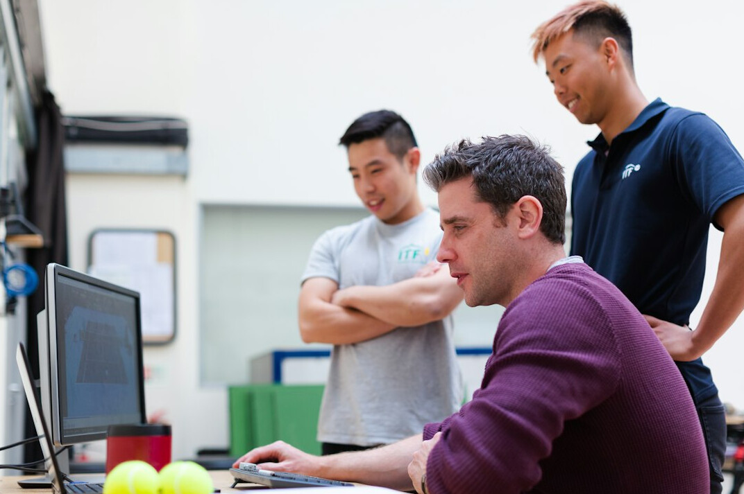 engineers working on custom software