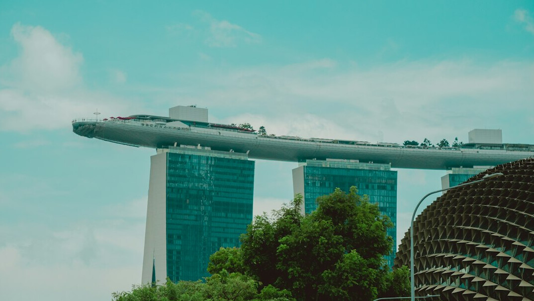 Modern open-plan software engineering office with skyline view in Singapore